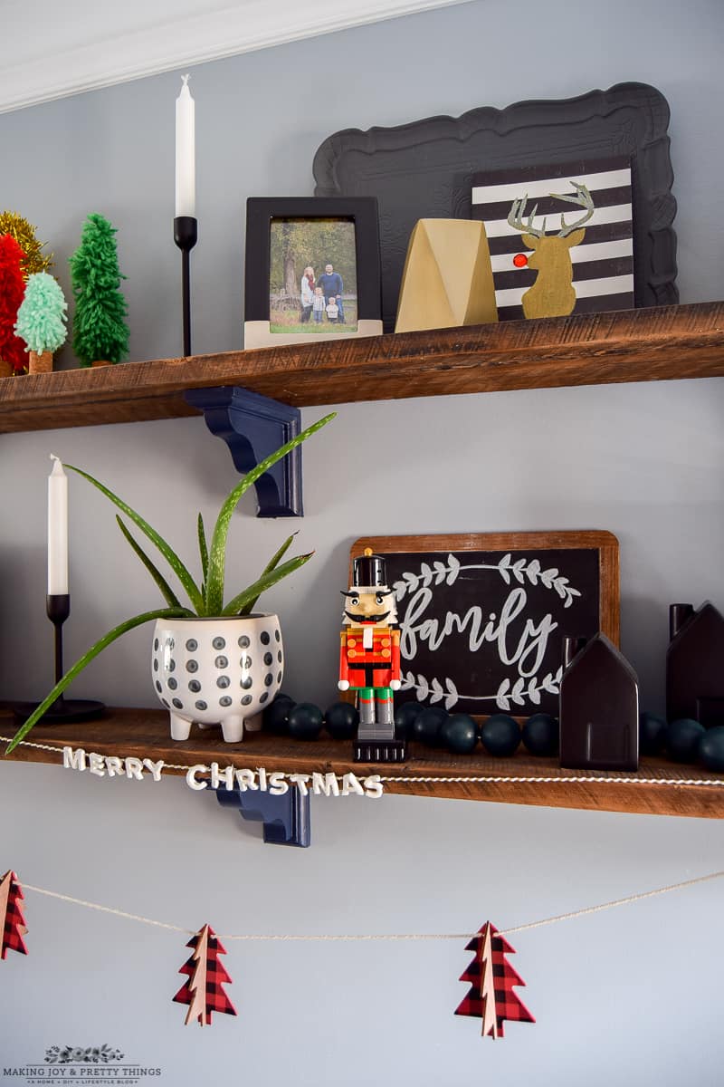 Shelves provide so many options for dining room Christmas Decor and make a big impact with a small amount of effort