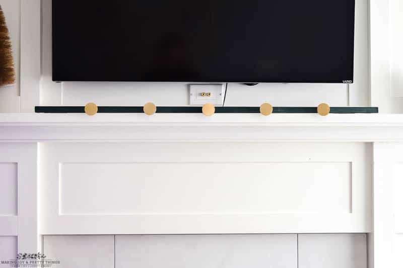 Anchor the support to your mantle using 3M strips to avoid any mishaps for the DIY stocking holder