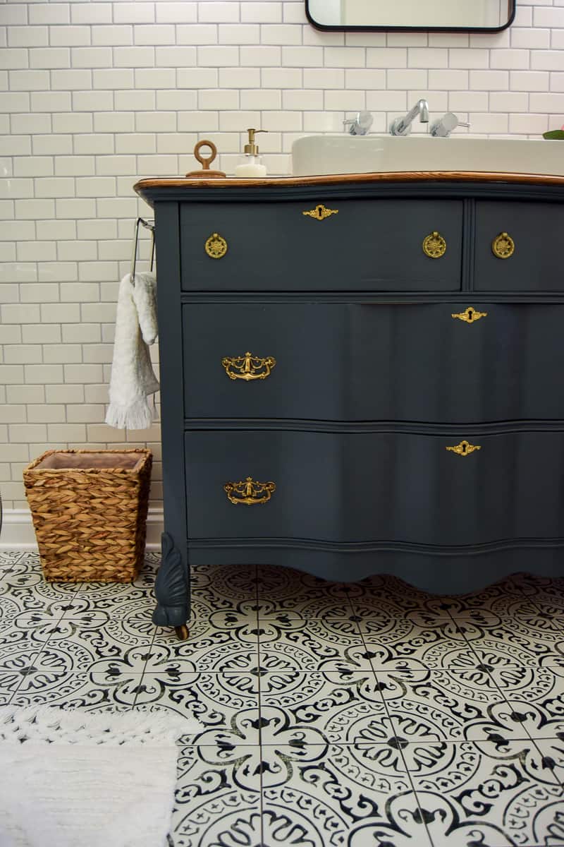 We updated this vintage dresser with a coat of deep forest green paint and new hardware.
