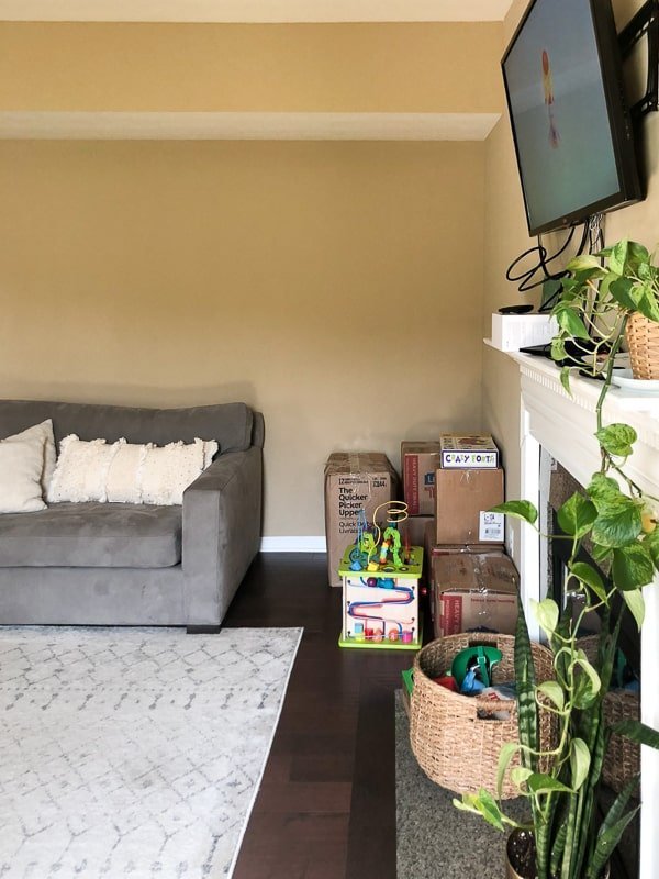 Showing the lack of storage space in the living room next to the fireplace that needs to be renovated