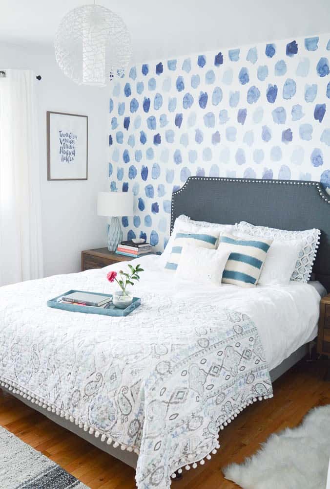 Blue watercolor polk dot wallpaper purchased online from Walls Need Love installed on a accent wall in bedroom