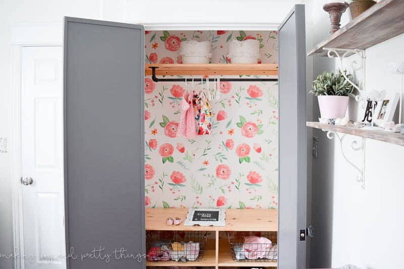 Floral wallpaper from Spoonflower installed in the back of a closet in a farmhouse nursery for baby girl
