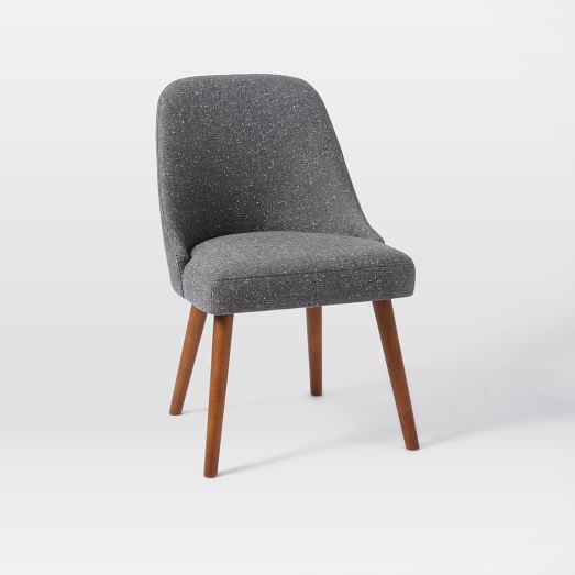 Charcoal gray upholstered chairs with wooden peg legs from West Elm.