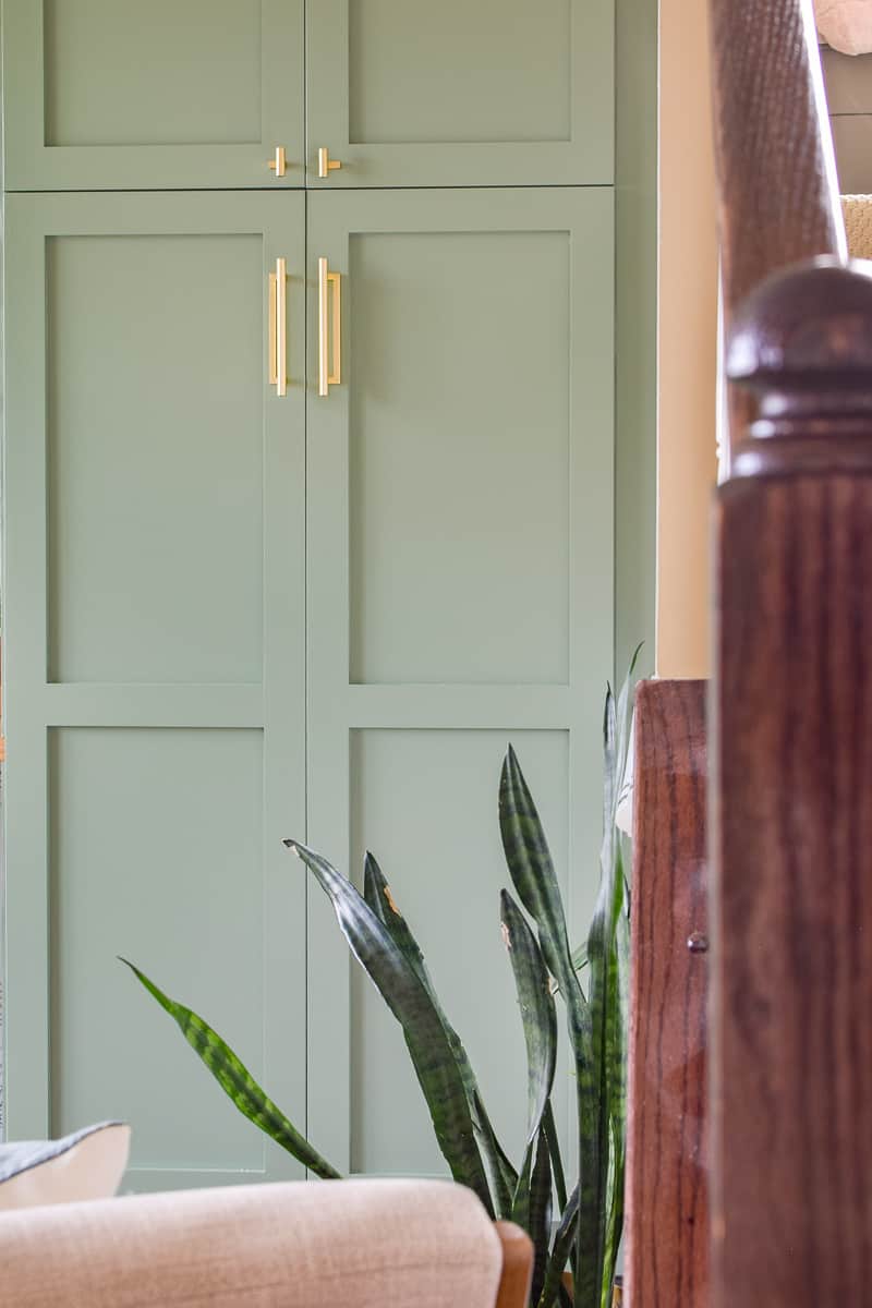 A pantry can be more than kitchen food storage when used in a living room next to stairs