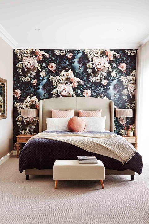 Wallpaper on one wall is a relatively easy way to get a focal point in a bedroom. I love this dark floral wallpaper behind the bed in this bedroom. 