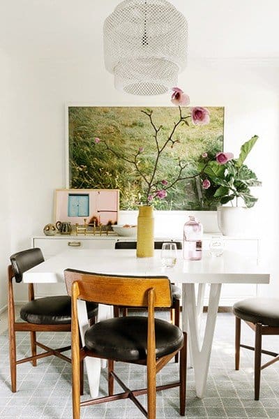 Hanging large artwork on the walls creates a focal point in a room. 