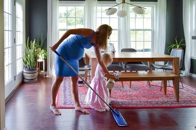 How to clean hardwood floors naturally with kids. This hardwood floor cleaner is gentle and effective at removing dust, dirt, and grime and is GREENGUARD GOLD certified so it’s safe to use with kids and pets. Get a clean house with a residue-free cleaner that leaves hardwood floors looking like new. #bonaessentials #hardwoodfloors #hardwood #cleanhouse