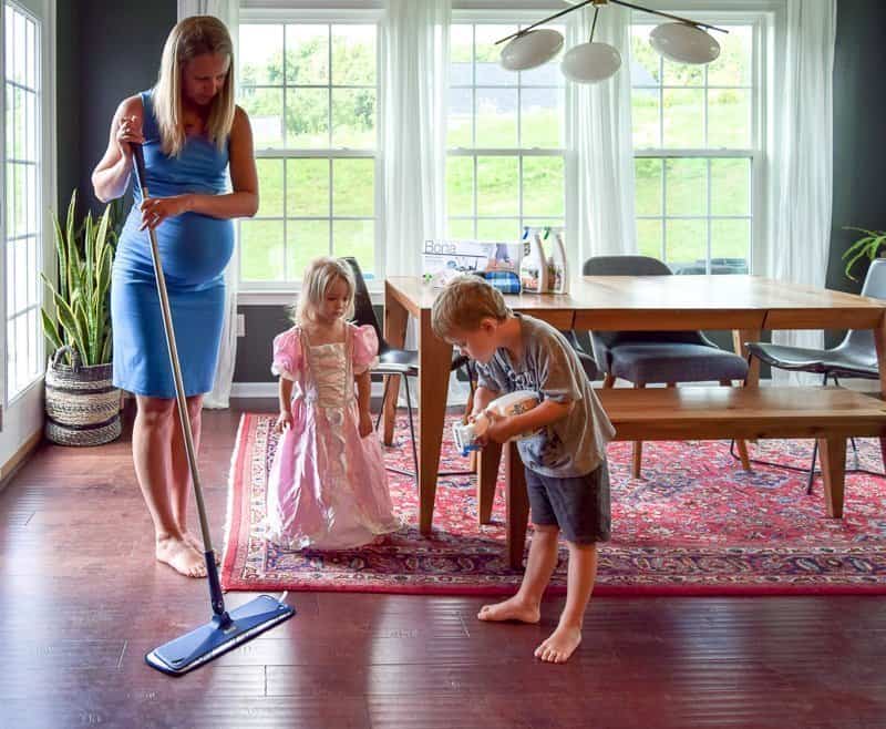 How to clean hardwood floors naturally with kids. This hardwood floor cleaner is gentle and effective at removing dust, dirt, and grime and is GREENGUARD GOLD certified so it’s safe to use with kids and pets. Get a clean house with a residue-free cleaner that leaves hardwood floors looking like new. #bonaessentials #hardwoodfloors #hardwood #cleanhouse