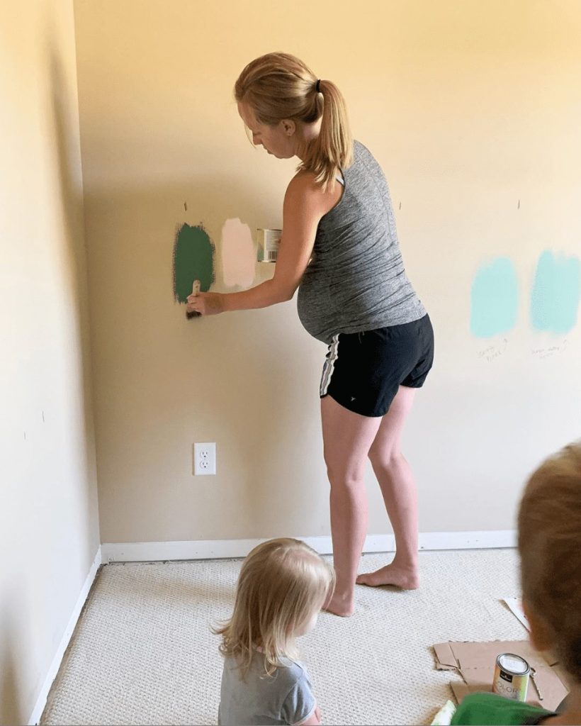 We painted several different paint color options up on the walls in our big girl's bedroom before deciding on Dream Whip by Benjamin Moore - a very pretty peachy pink color