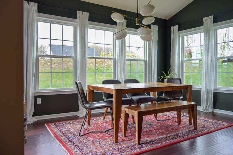 Dining room makeover and renovation with a bench style table with chairs and an eclectic light fixture