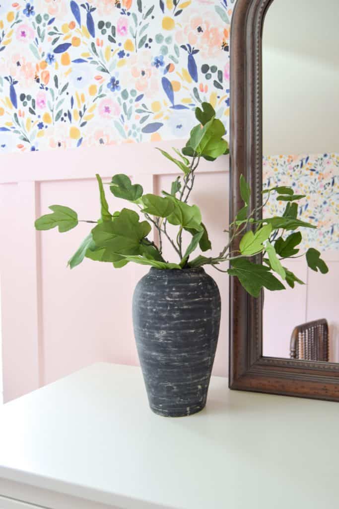 I love the aged pottery look on this vintage vase, created with paint, plaster, and a lime wash, filled with faux greenery.