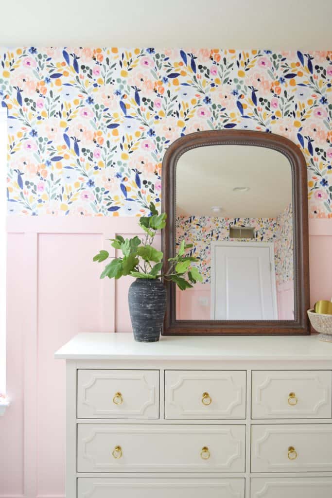 A look at the new aged black vase in my daughter's room - a statement piece on the white dresser, mirror, and bright floral colors of the room.