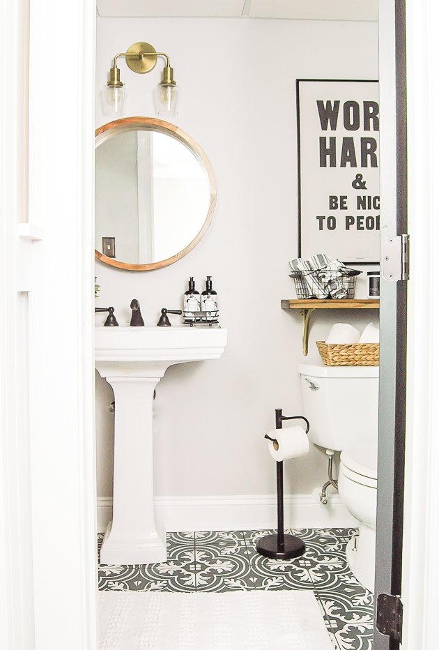 The bathroom adorned with the calming shade of On The Rocks gracing its walls.