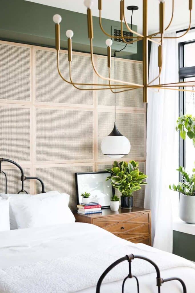 DIY cane webbing used as wall panels to create a can look accent wall in a bedroom with modern touches