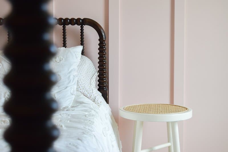 Looking for DIY nightstand ideas? I tried my hand at DIY cane projects with a DIY cane nightstand for Evie’s toddler girl room! I used a stool from Target, some spray paint, and cane to make a DIY nightstand. It’s the perfect addition to a little girl’s room if you’re looking for girl room ideas. The DIY cane nightstand was an easy DIY that adds tons of style and function to her girly room. #cane #canefurniture #diyprojects #diycanenightstand