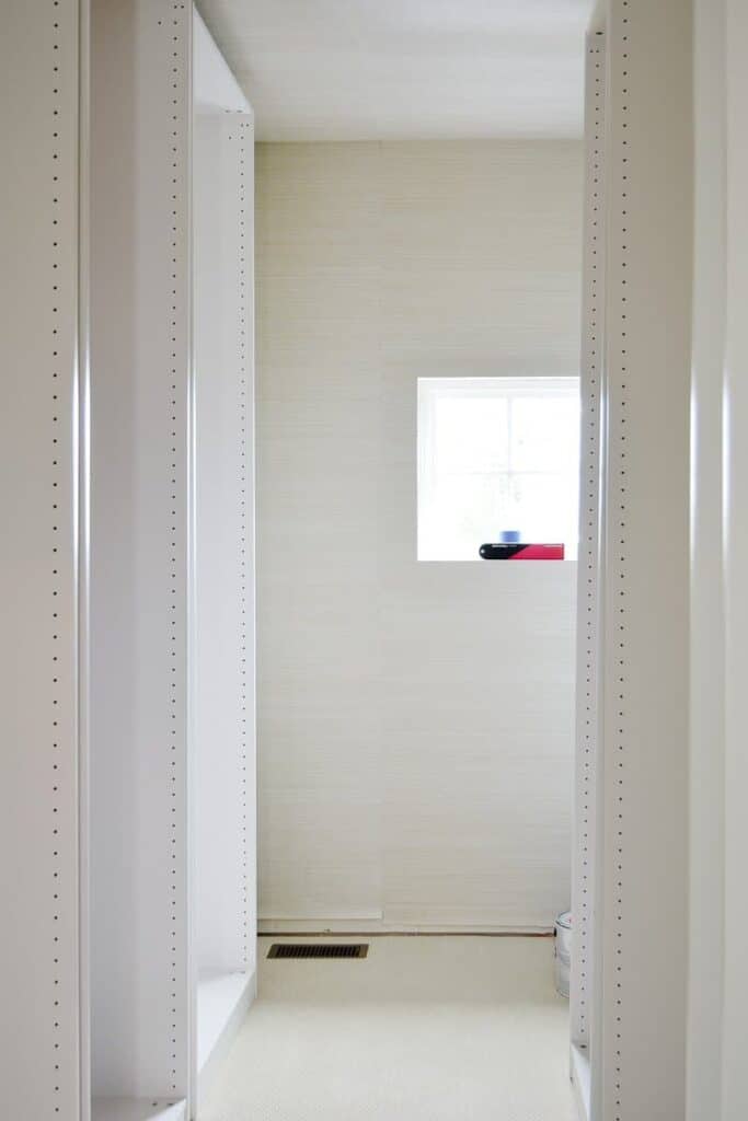 A closet cabinet without shelves.