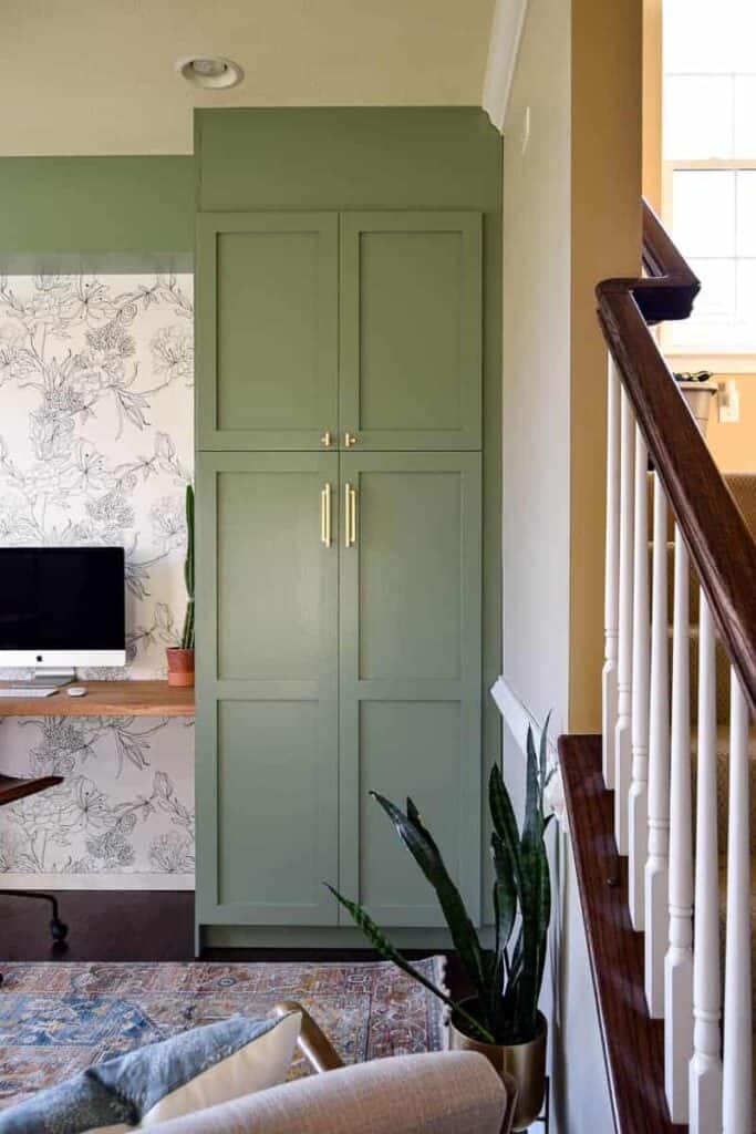 tall cabinet in home office painted in sage green paint color