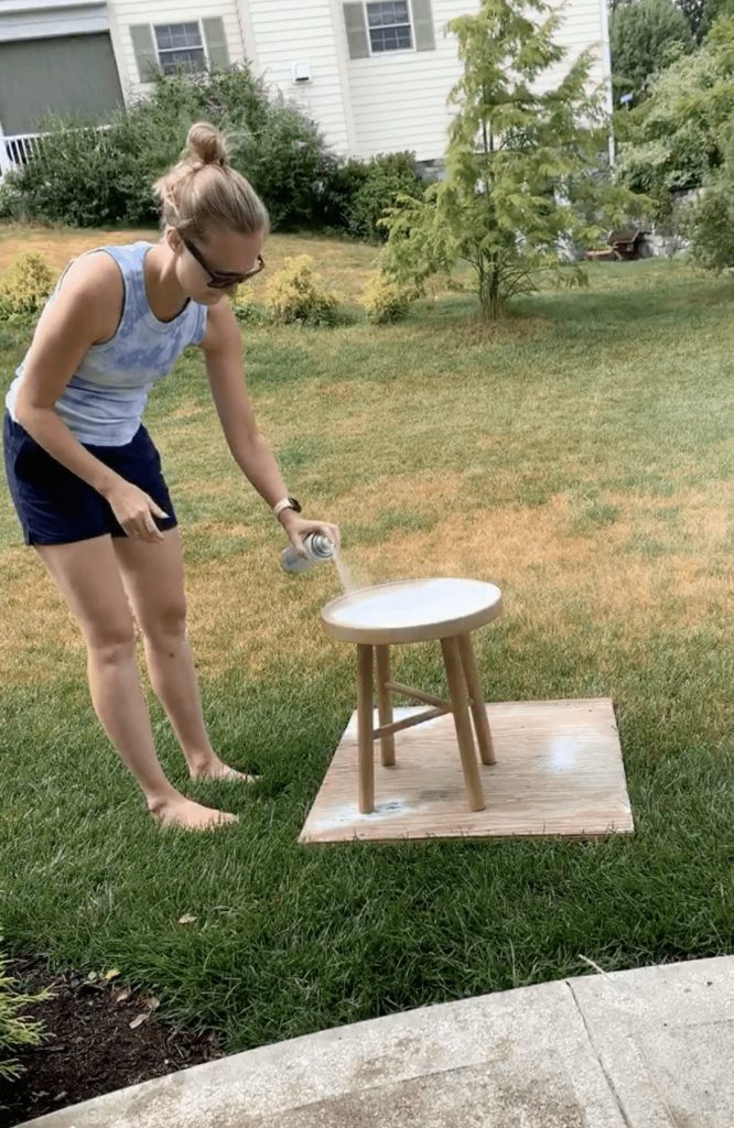 Painting a night stand purchased from target white to prepare the surface for DIY cane webbing