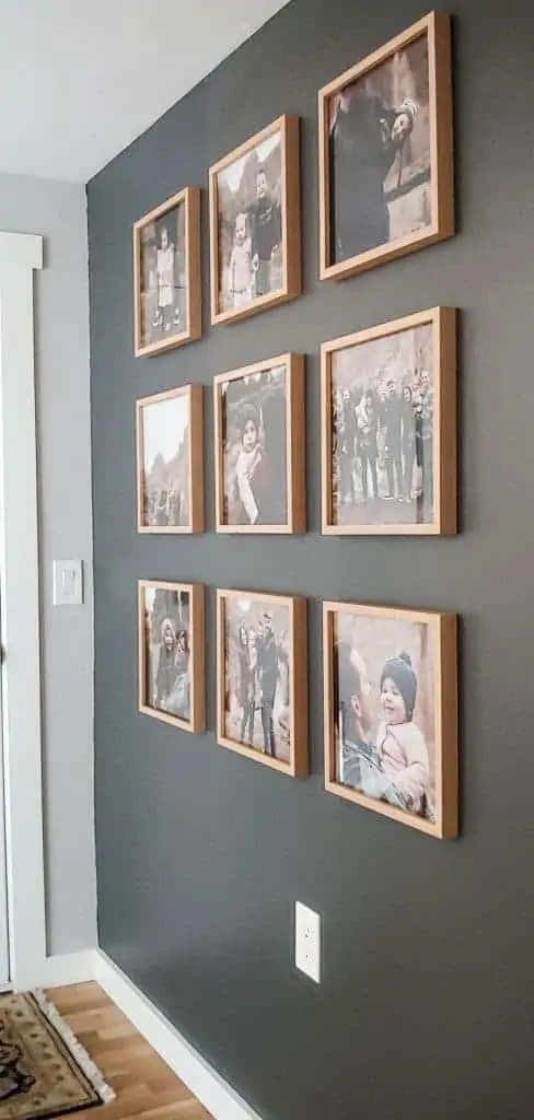 If you are looking for more contrast in the way you display your family photos on dark wall then this grid-style gallery wall is perfect for you