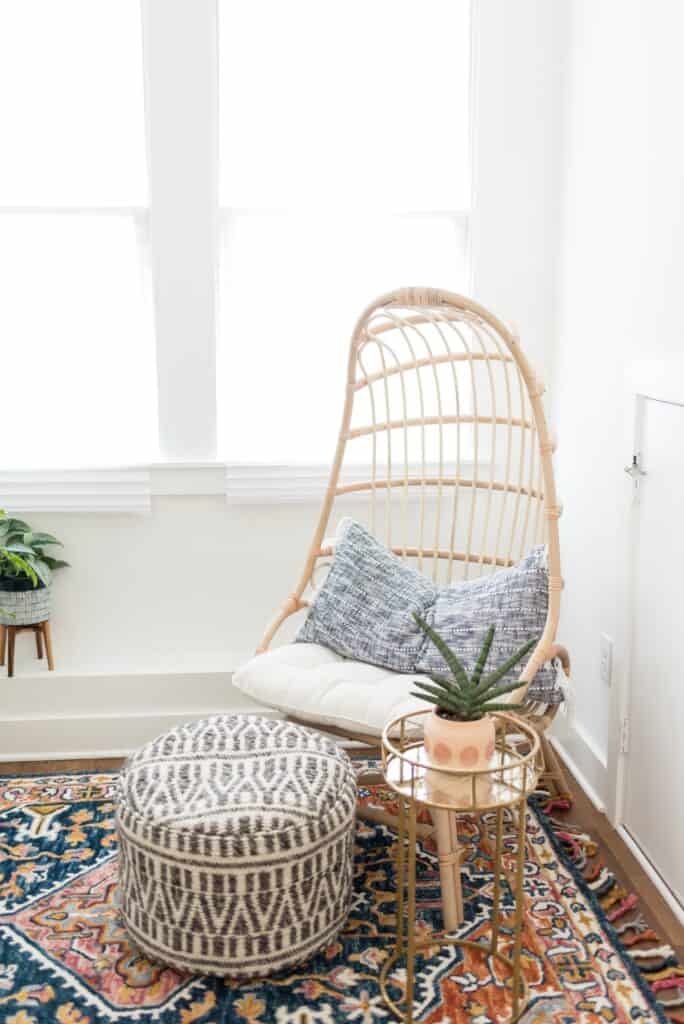 The boho interior style features a lot of bold patterns and bright colors, a lot of texture, which can be seen with things like rattan furniture and layered area rugs. Houseplants are also very popular in the boho home design style. 