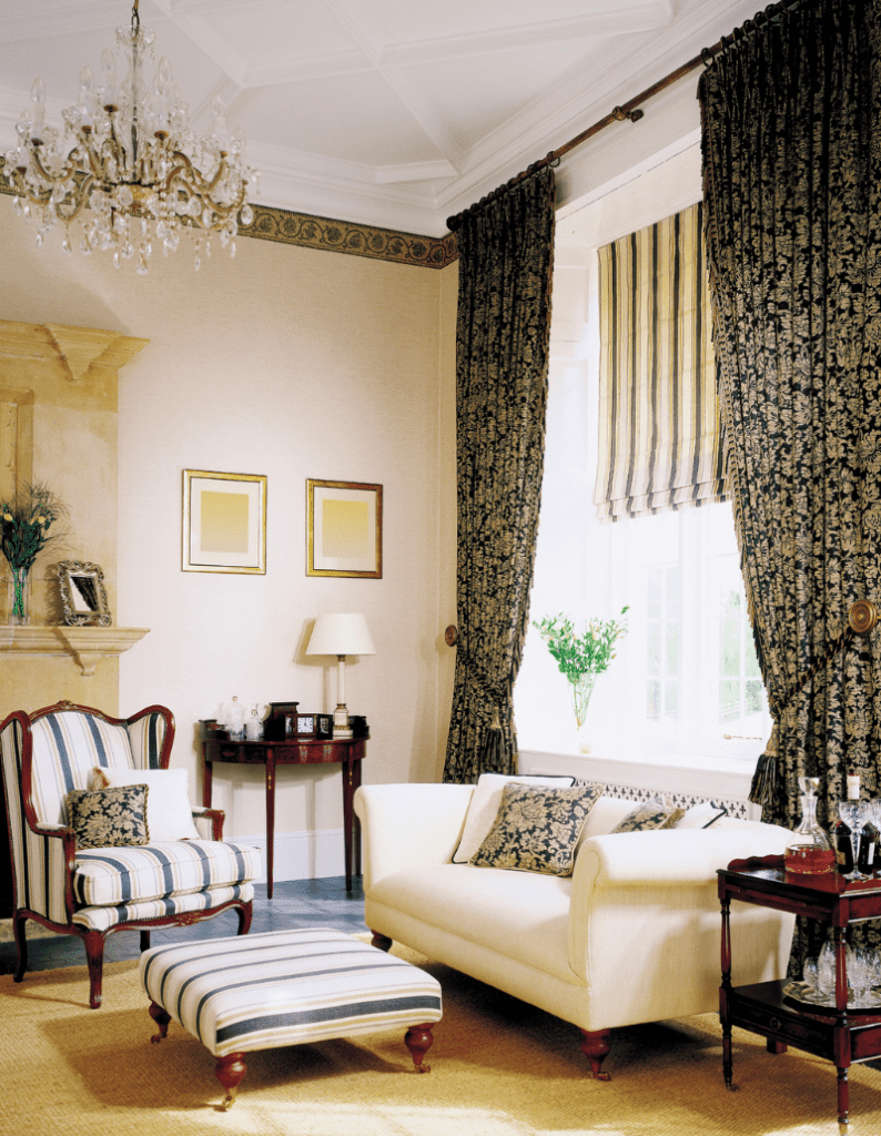The traditional interior design style is reflected with older art pieces and antique furniture with muted and classy color scheme. You'll also see traditional style furniture, typically with dark wood finishing. Heavy drapery with classic patterns and ornate chandeliers are popular with the traditional style. 