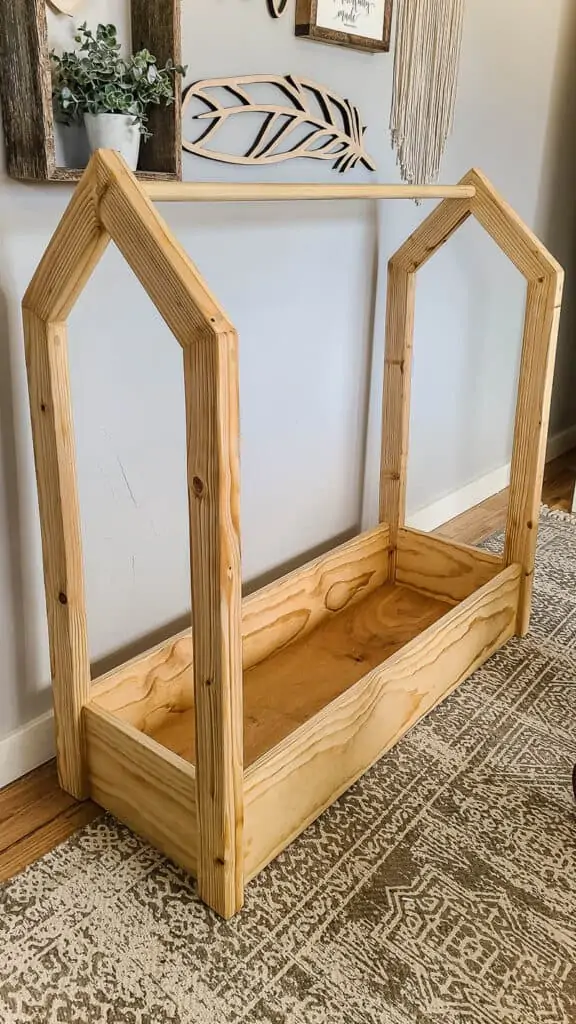 This wooden montessori clothing rack is great for small kids to be able to take responsibility of hanging up their own clothes. 