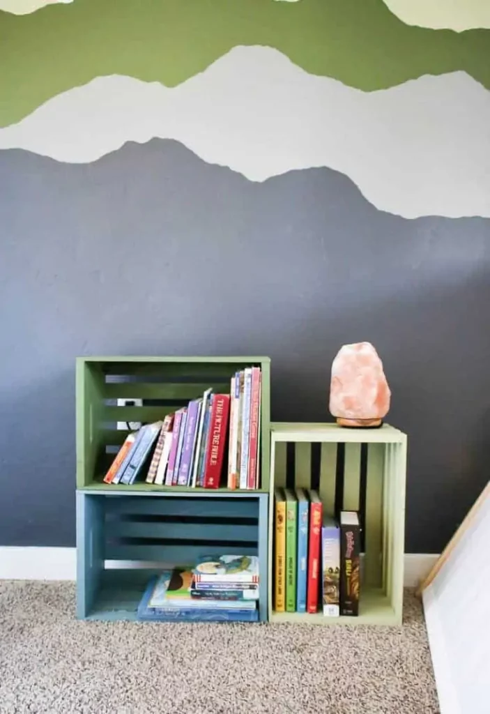 Make your own wooden crate bookcase by painting wood crates and stacking them on their sides