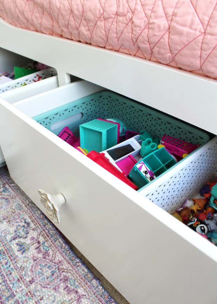Buy a bed with storage drawers underneath to reclaim even more space in your kiddo's room for organizing