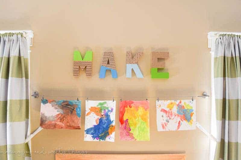 Display your kid's artwork in their room or playroom for a personal touch. 
