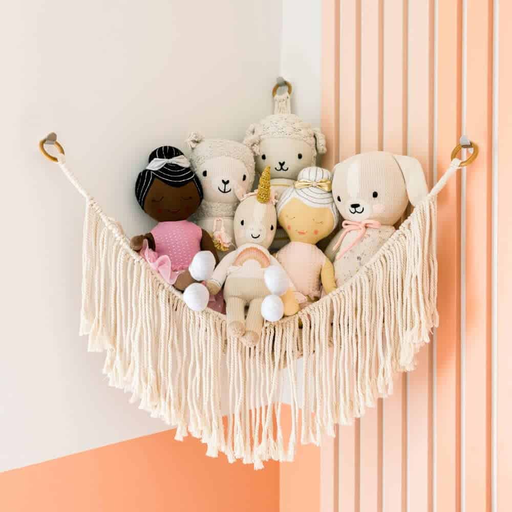 Hanging nets for the corners, like this, keep soft toys like dolls and stuffed animals up off the floor 