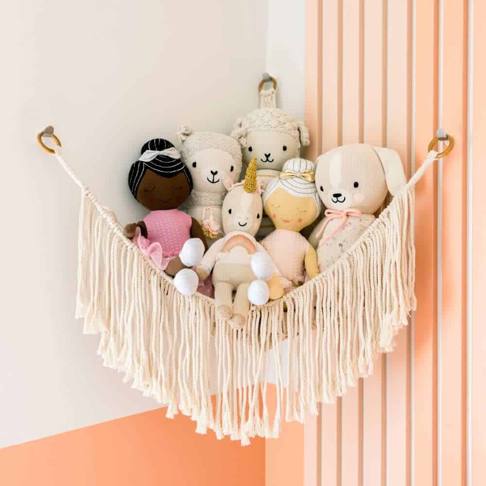 Hanging nets for the corners, like this, keep soft toys like dolls and stuffed animals up off the floor