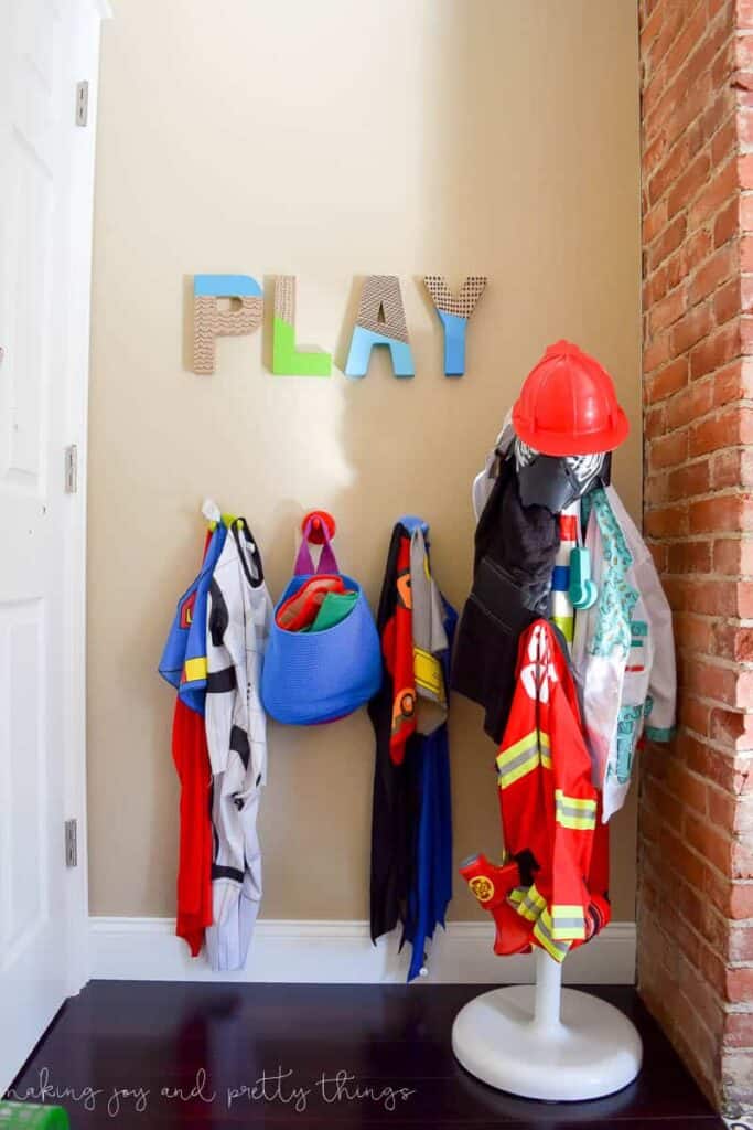 Hooks on the wall and coat racks are a great addition to any kid's space for organizing coats, backpacks or dress up clothing 