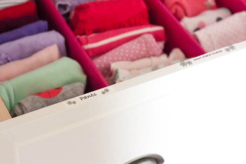 If you are struggling to organize your child's dresser drawers, try using drawer dividers and labels on the drawers.