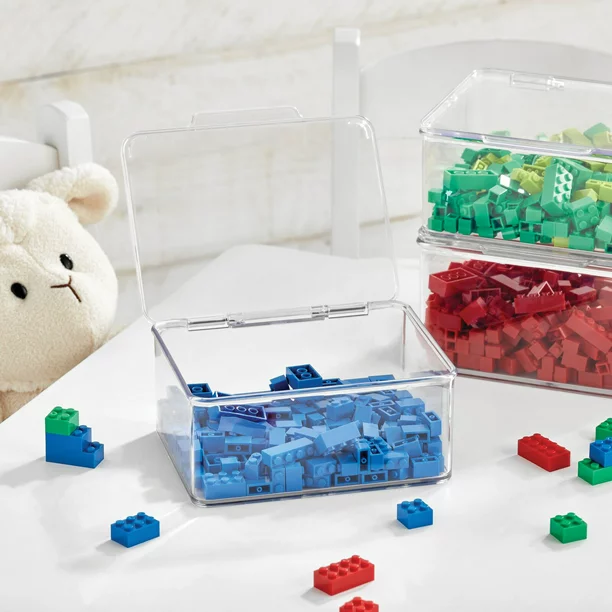 Organizing small toys in a kid's room can be tough. Put your legos and other small things in clear storage bins with lids, like this.