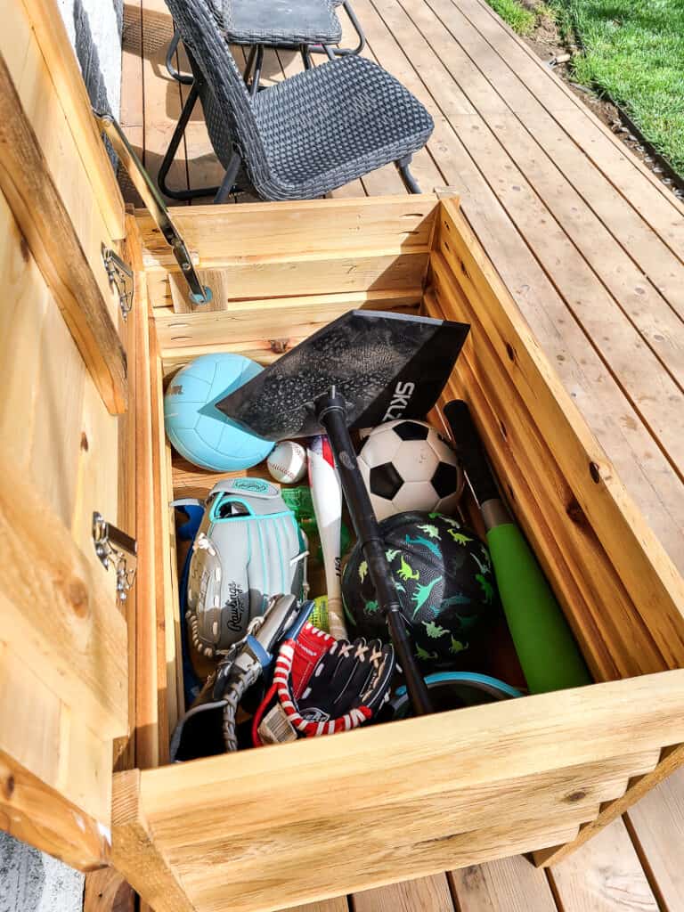 Get your outdoor toys organized in your backyard with this DIY deck box