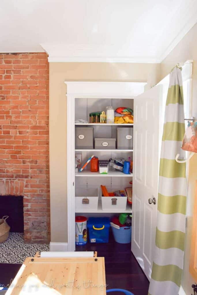 A toy storage closet is great in a bedroom that also functions as a play room for kids. Use shelves with labeled baskets to keep the toys organized.