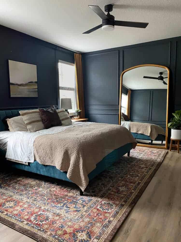 I love this dark and moody master bedroom with a 9x12 rug under the King size bed