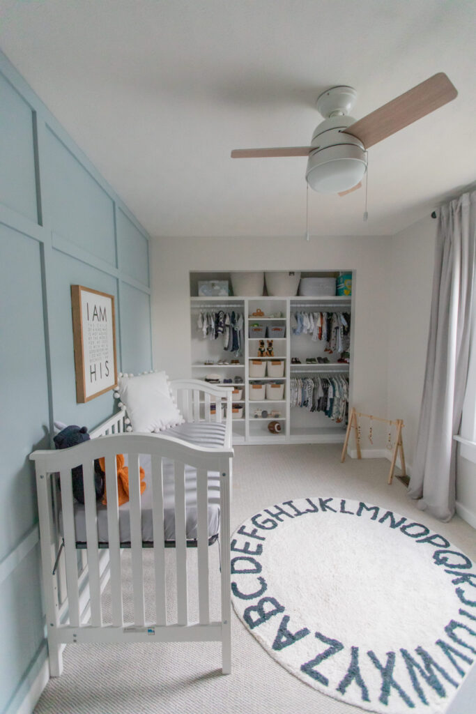 Calm and neutral baby boy nursery with one accent wall painted with Smoke by paint from Benjamin Moore 