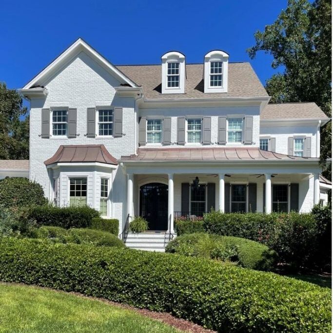 SW Alabaster painted on exterior of house with brick and gray shutters