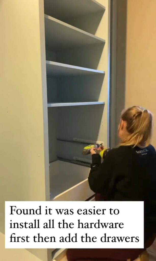 Women installing all the hardware for the drawers in the IKEA Pax wardrobes in walk in closet 