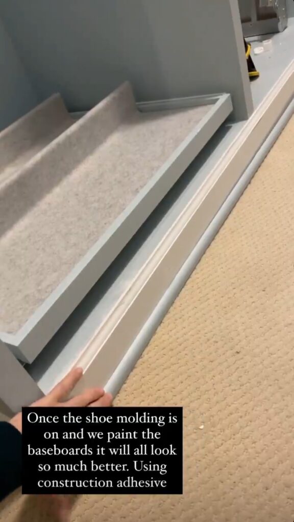Once the show molding is installed along the bottom edge of the baseboards, it hides the uneven edge at the base of the IKEA Pax wardrobes 
