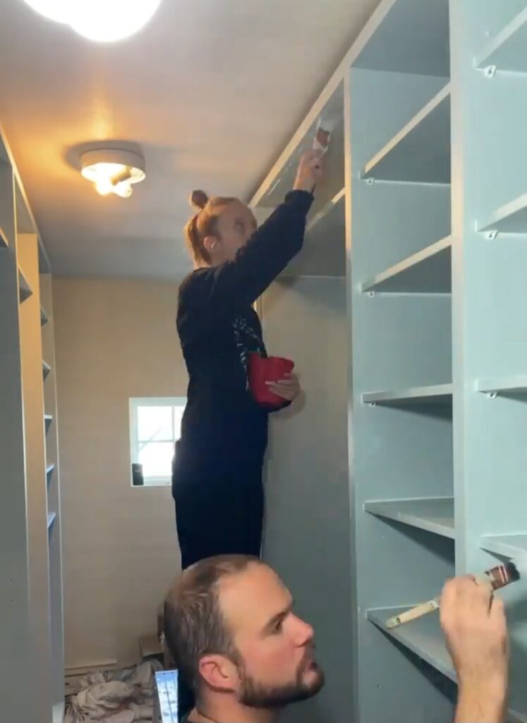 Both men and women were painting the closet.